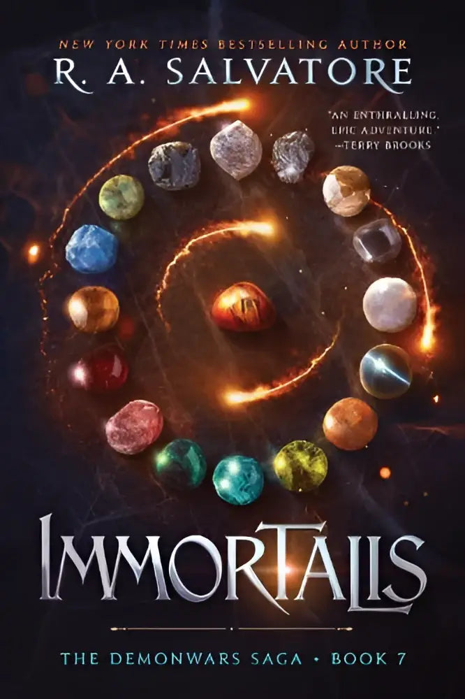 De boekcover van immortalis the demonwars saga boek 7 toont een cirkel van kleurrijke edelsteenachtige orbjes op een donkere vurige achtergrond