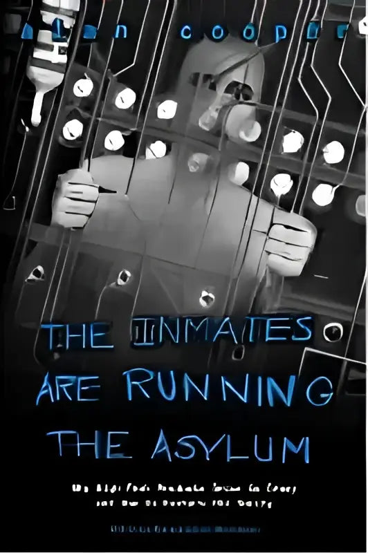 De boekcover toont titel the inmates are running the asylum in gedistressed blauwe letters voor een technologieboek