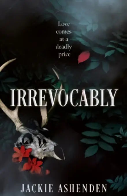 De boekcover van irrevocably door jackie ashenden toont een wit hertenschedel met rode bloemen op een donkere achtergrond