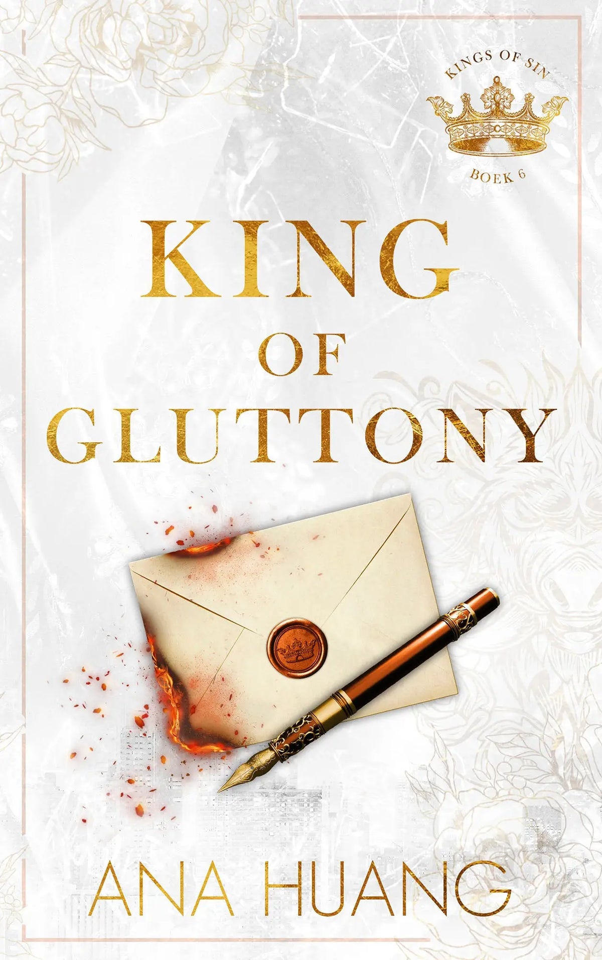 White book cover with gold embossed title king of gluttony and ornate crown logo beside vintage envelope and pen by ana huang love books