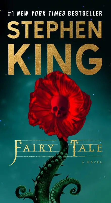 Cover van stephen king fairy tale met rode bloem en schedel in het midden op de omslag van de roman