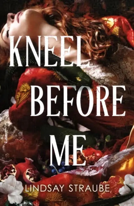 De boekcover van kneel before me van lindsay straube toont een vrouw in rood en goud liggend op rijk versierd textiel