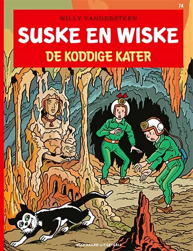 De cover van het stripboek de koddige kater door willy vandersteen toont groene personages en een zwart-witte kat in een oranje grot
