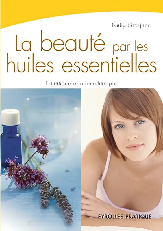 Blauw flesje essentiële olie met witte dop omgeven door paarse bloemen voor esthetique et aromatherapie par les huiles