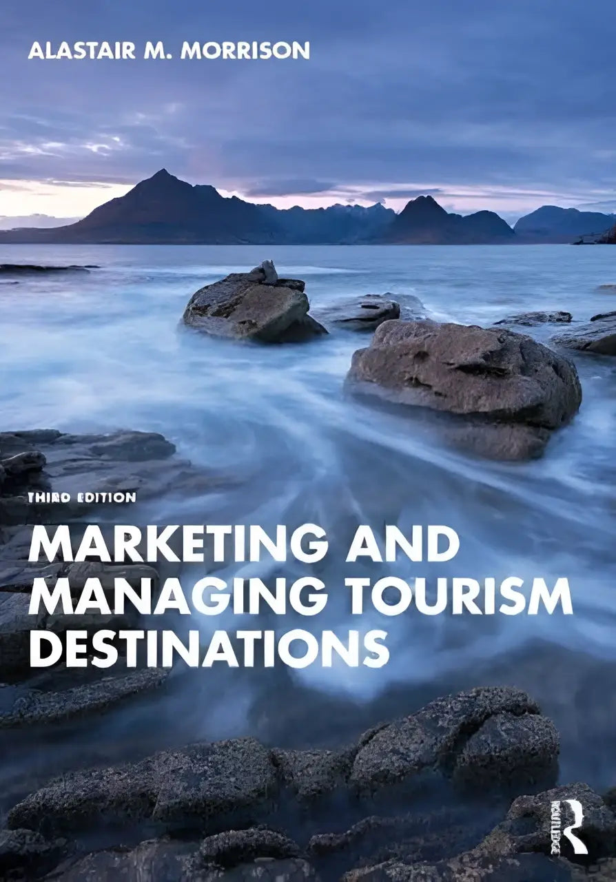 The book cover of marketing and managing tourism destinations shows a serene coastal scene for destination management guidance