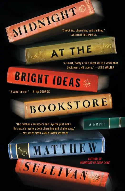 Stapel hardcover romans met kleurrijke ruggen en gouden letters van midnight at the bright ideas bookstore novel