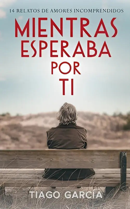 De boekcover van mientras esperaba por ti toont rode titelletters en een persoon op een houten bank in een woestijnlandschap
