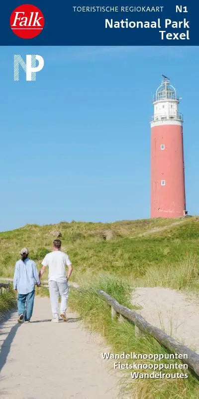Rood-witte vuurtoren op een grasduin in nationaal par texel onder een heldere blauwe lucht
