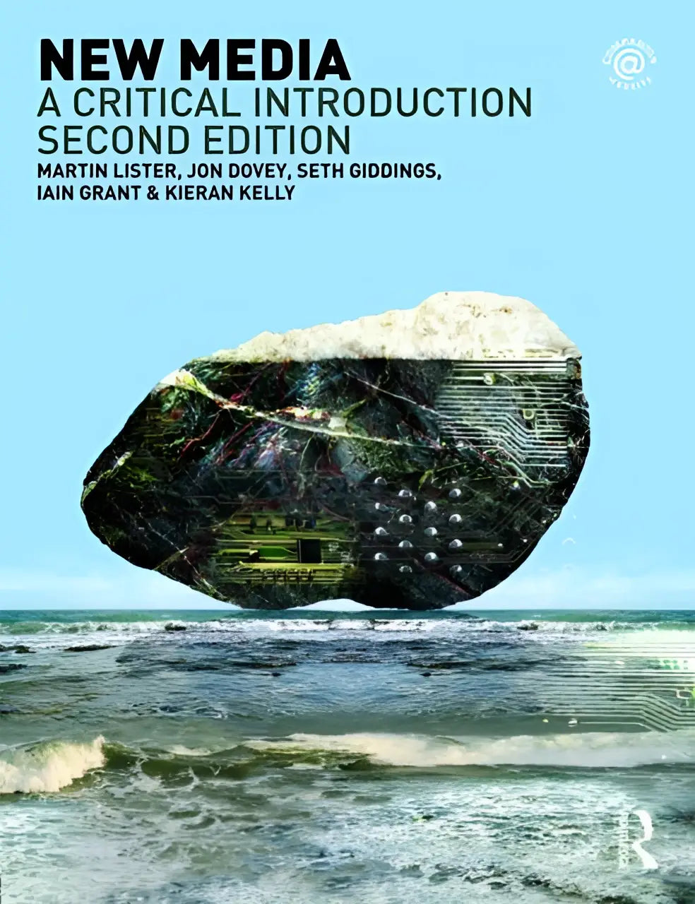 A striking black and silver rock with embedded circuit board patterns floating above ocean waves in new media critical introduction