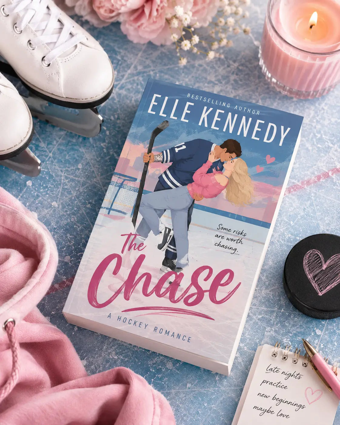 The chase by elle kennedy is a paperback contemporary fiction hockey romance with a blue and pink cover showing an illustrated couple on ice