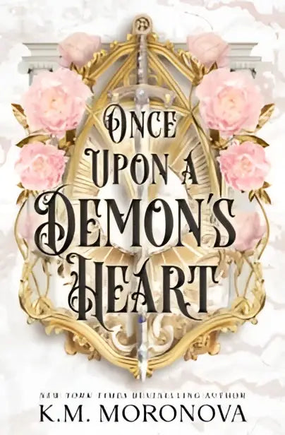 Ornate gouden en roze bloemrijke hardcover van once upon a demons heart door k.m. met demon’s heart thema