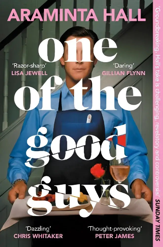 Man in blue apron holding plate with food and glass of wine for judy book club pick one of the good guys