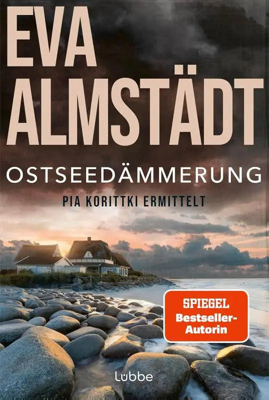 The book cover of ostseedämmerung by eva almstädt shows a coastal village at sunset for pia korittki ermittelt