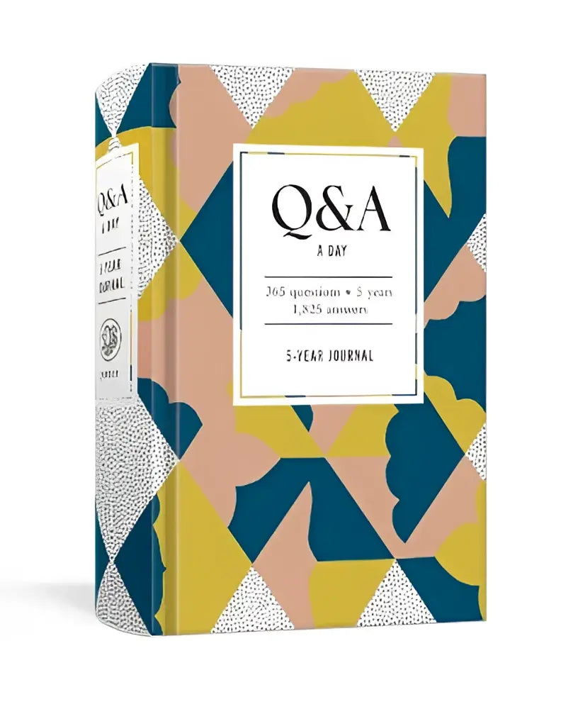 A vibrant geometric patterned hardcover q&a a day modern 5-year journal in yellow teal and blush pink with white triangles