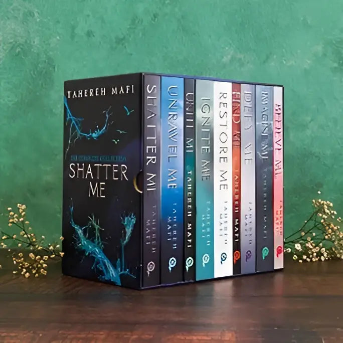 Restore me tahereh mafi special collector’s edition with striking blue and black cover and teal accents from shatter me box set
