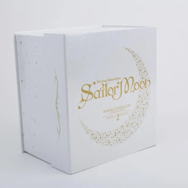 Witte rechthoekige manga box set met goudfolie en maanster design uit de naoko takeuchi collection sailor moon