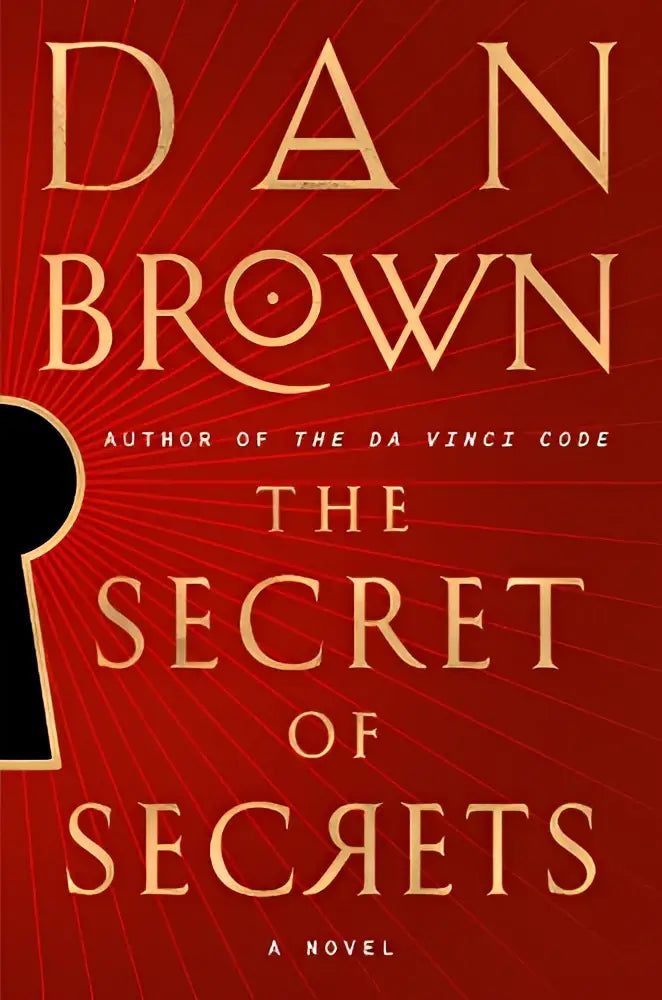 De roman secret of secrets van dan brown heeft een dieprode kaft met goudkleurige letters en stralende lijnen
