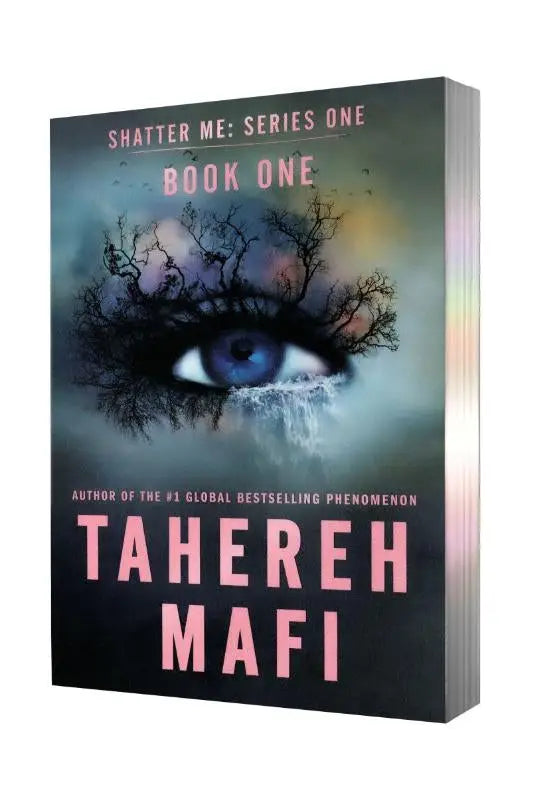 The shatter me paperback deluxe limited edition book cover features a striking eye design at its center