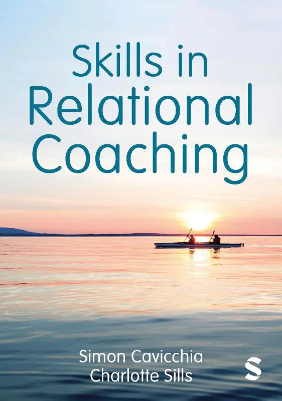 The book cover for skills in relational coaching by simon cavicchia and charlotte sills shows a sunset with two people kayaking