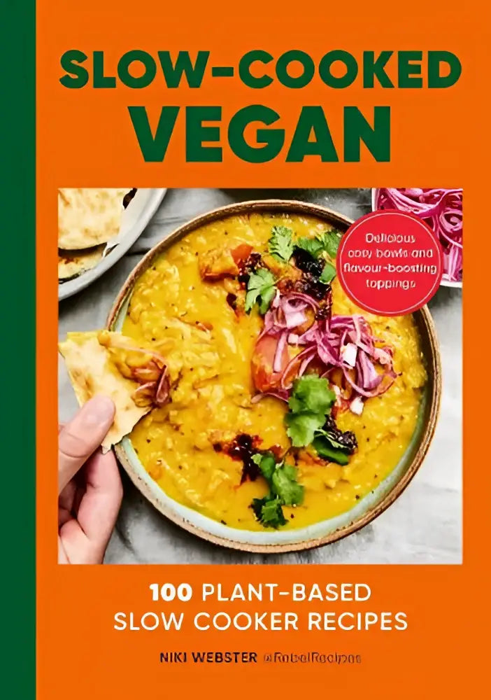 The slow-cooked vegan cookbook by niki webster features a vibrant orange cover with green text and a yellow lentil curry image