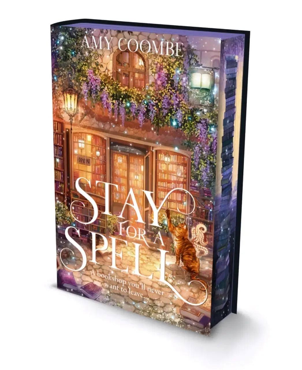A hardcover special edition book stay for a spell by amy coombe with a cozy bookstore and purple wisteria cover