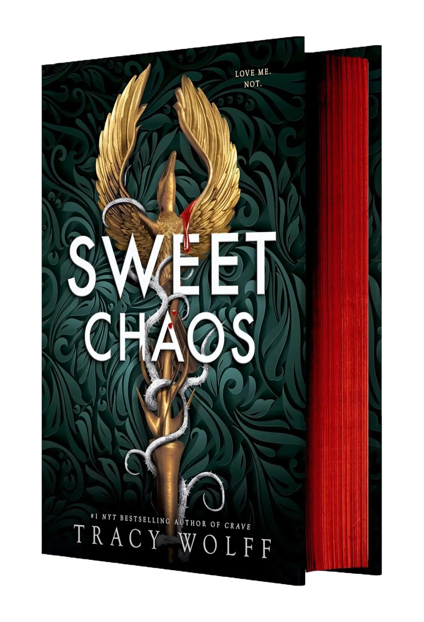 The book sweet chaos by tracy wolff features golden wings and serpentine designs on a dark green cover with red pages