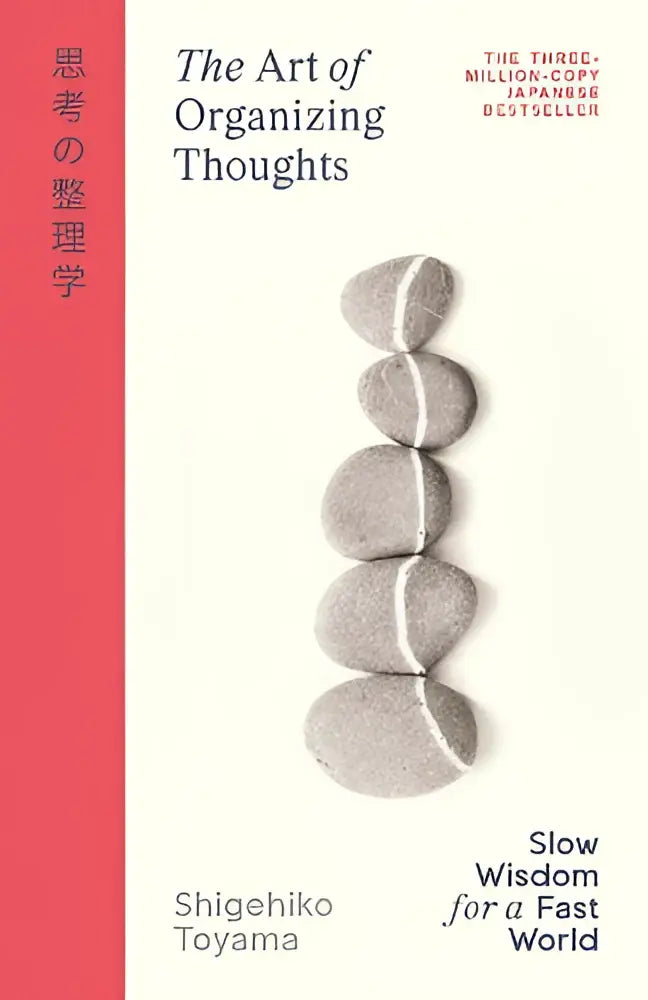 The art of organizing thoughts boek met witte kaft en vijf grijze stenen van shigehiko toyama