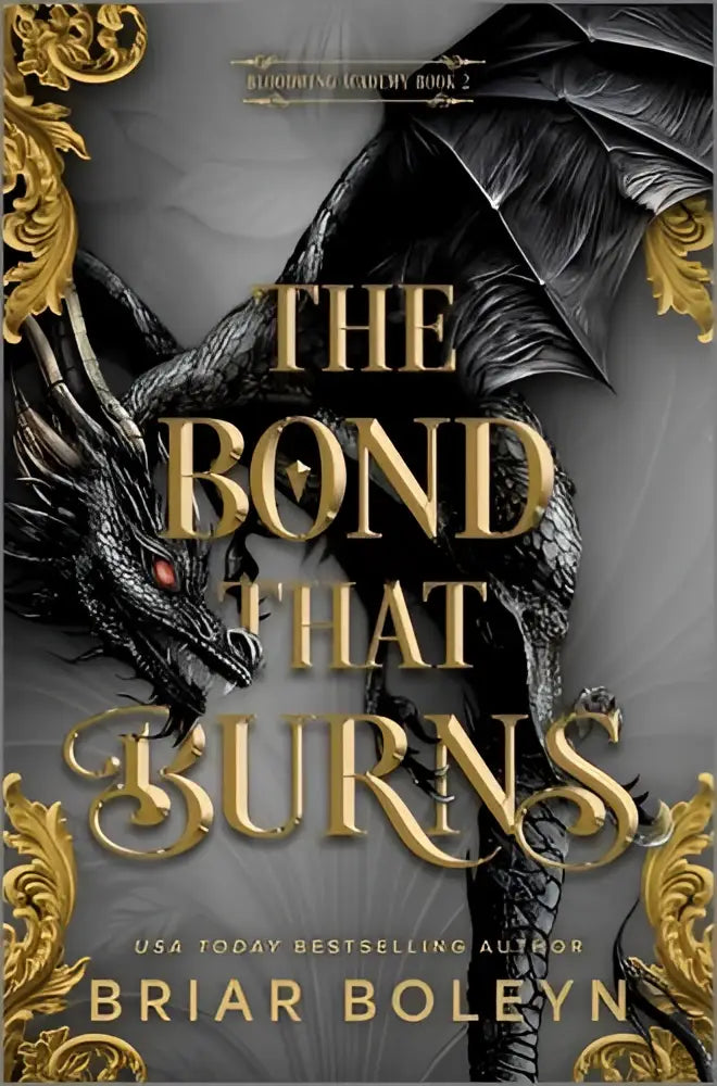 The bond that burns standard edition novel features a black dragon with red eyes and gold ornate borders on the cover