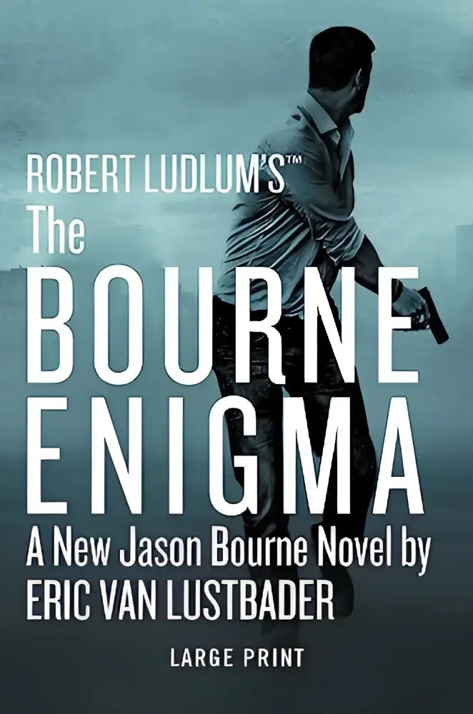 De omslag van robert ludlums the bourne enigma grote letter editie met man in lichtgekleurd overhemd en pistool