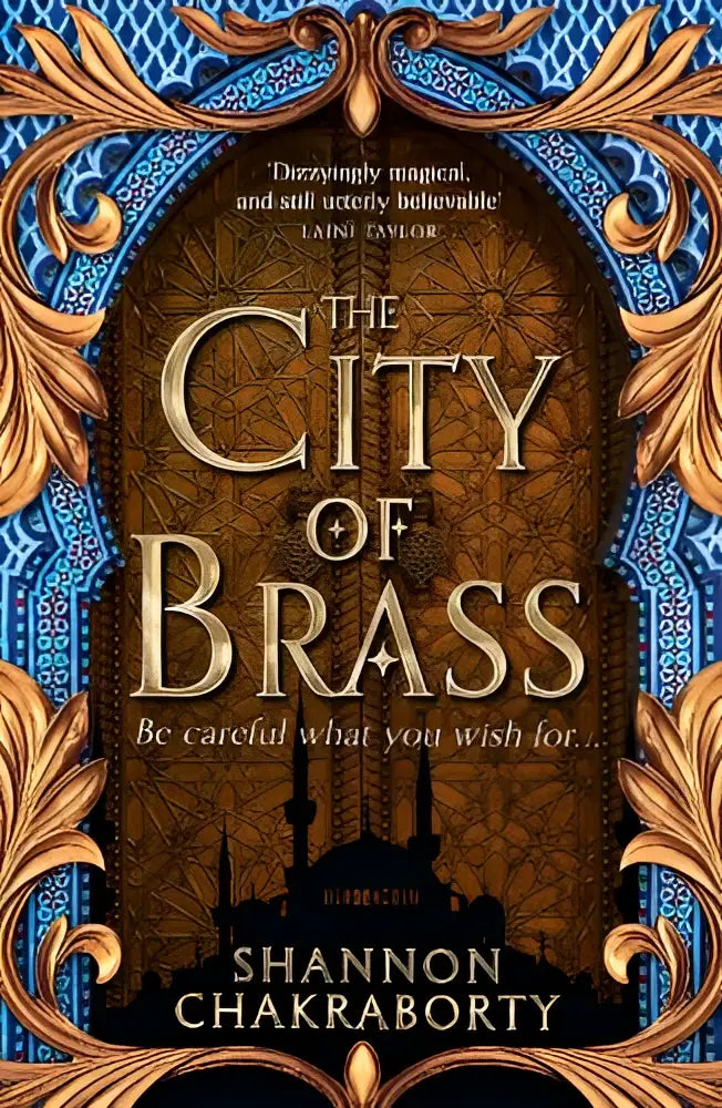 The city of brass book cover from the daevabad trilogy features ornate gold and blue decorative borders with intricate brass architecture