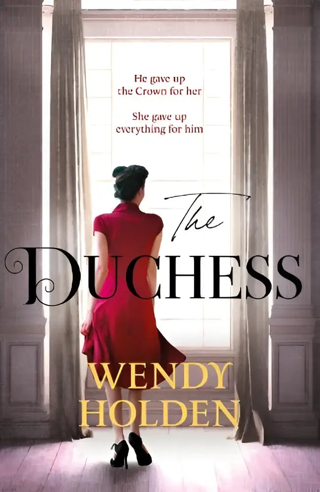 A woman in a flowing red dress stands before an ornate doorway in the sunday times bestselling novel The Duchess