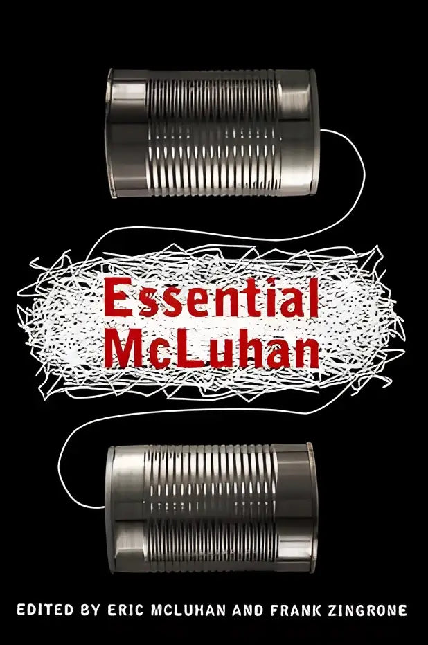 The essential mcluhan boekomslag met rode titel en witte draad tussen metalen blikken op zwarte achtergrond