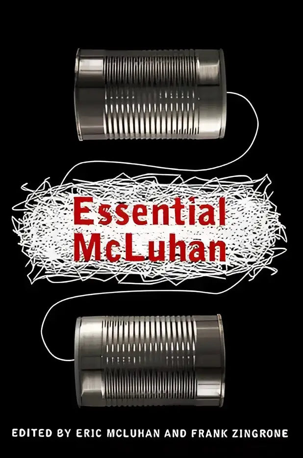 The essential mcluhan boekomslag met rode titel en witte draad tussen metalen blikken op zwarte achtergrond