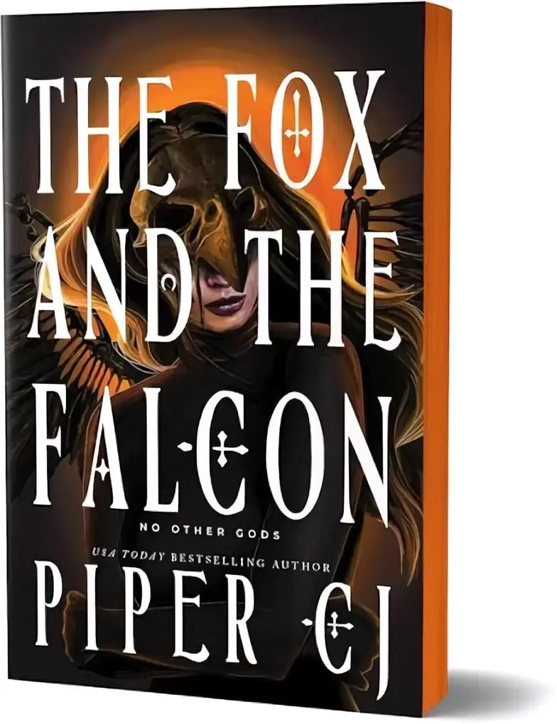 Het fox and the falcon deluxe edition boek met zwart omslag en gouden vosbont illustratie op vurige achtergrond