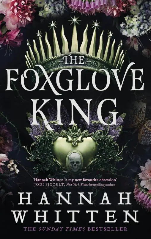 The foxglove king book cover features a metallic green crown and heart with a skull emblem in the sunday times bestselling romantasy