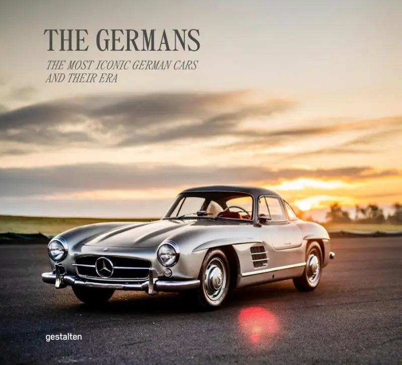 Zilveren mercedes-benz 300 sl gullwing met chromen accenten en kenmerkende vleugeldeuren in de meest iconische german cars collectie