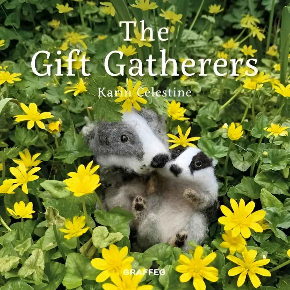Two hand-felted badger figurines in gray white and dark hues nestled in yellow flowers from the gift gatherers