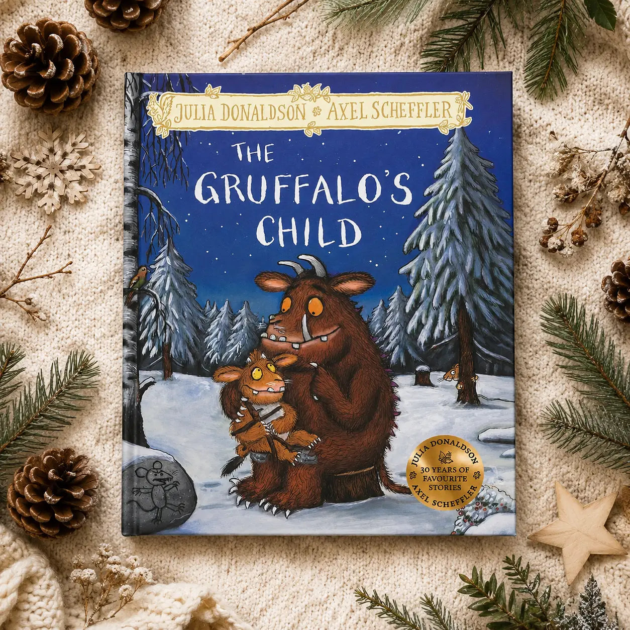 The gruffalo’s child hardback gift edition by julia donaldson and axel scheffler features vibrant blue cover with gruffalo in snowy forest