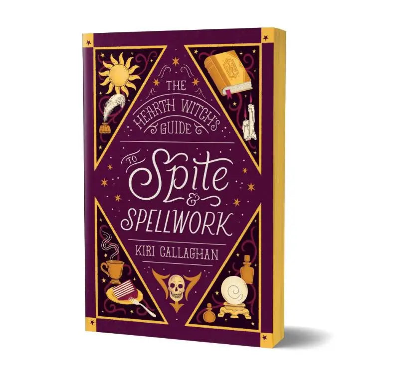 Paarse hardcover gids the hearth witch’s met goudfolie illustraties van hekserijsymbolen voor guide to spite