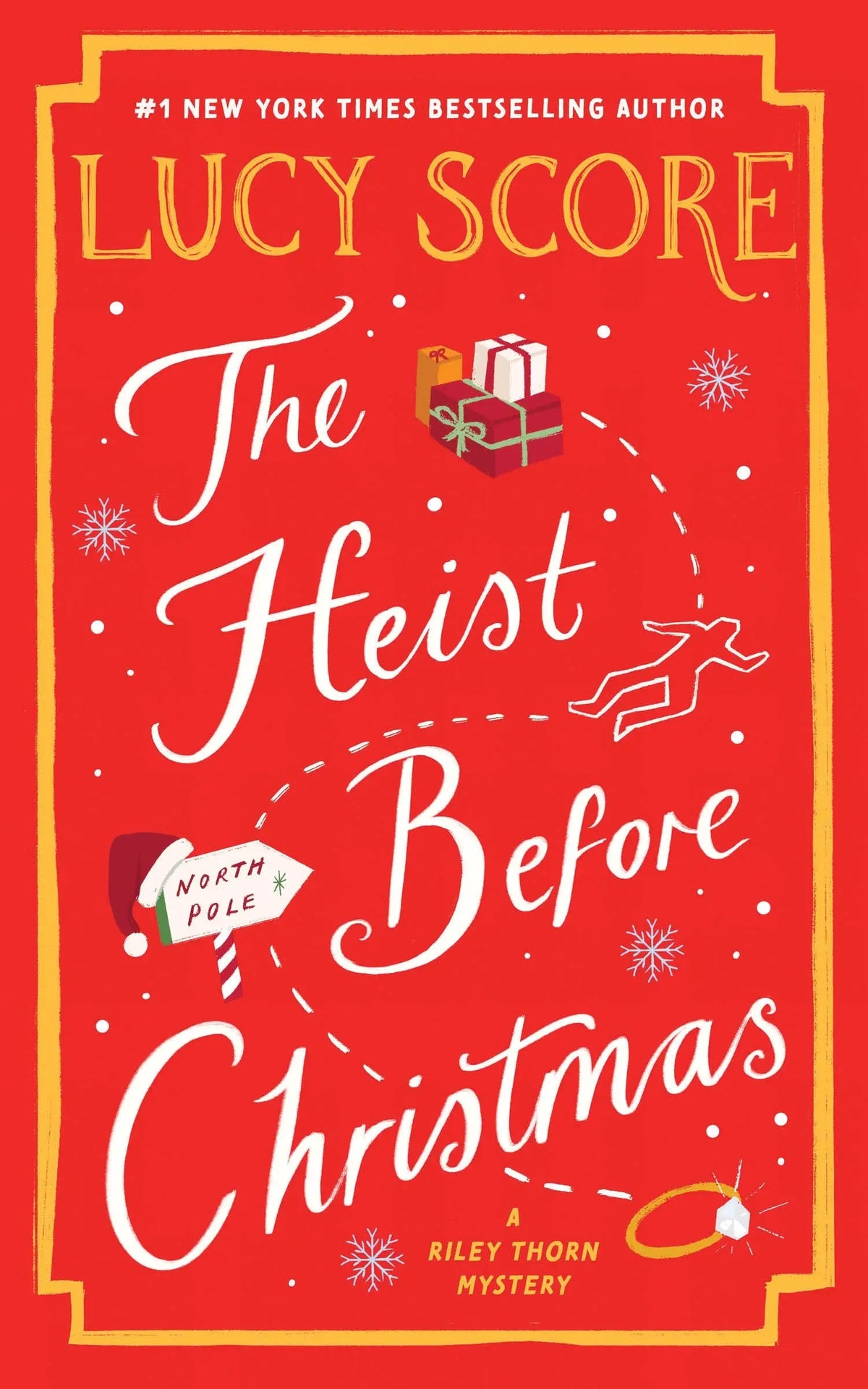Rode boekomslag met witte cursieve tekst the heist before christmas en gouden letters auteur lucy score