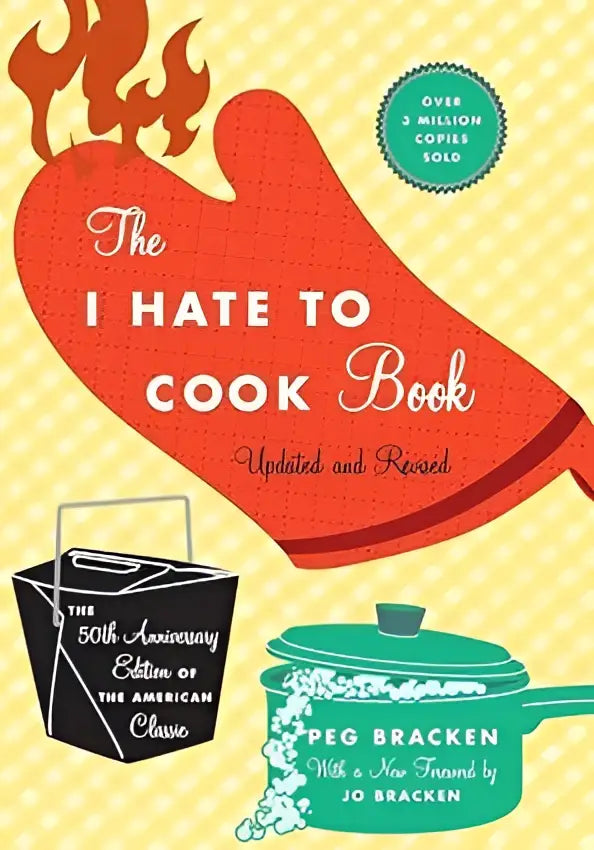 The i hate to cook book 50th anniversary edition met een rode ovenwantvormige kaft en witte tekst met keukentekeningen