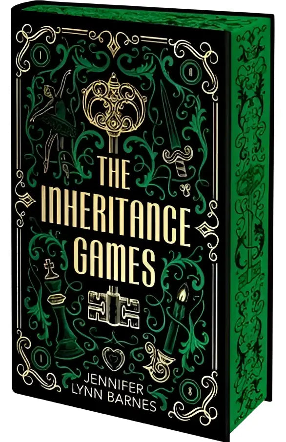 The inheritance games deluxe edition book features an ornate black and emerald green cover with gold foil detailing