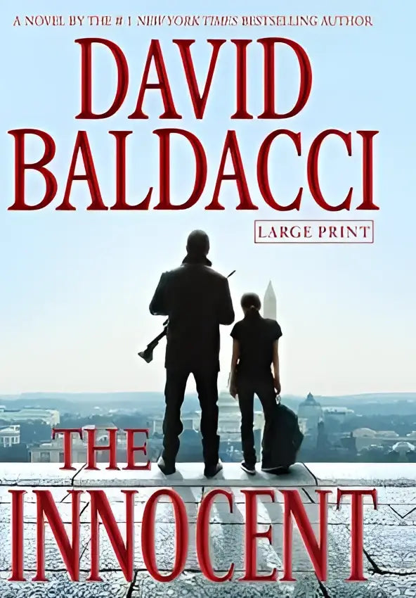 The innocent large print paperback novel by david baldacci with bold red lettering and rooftop cityscape silhouettes