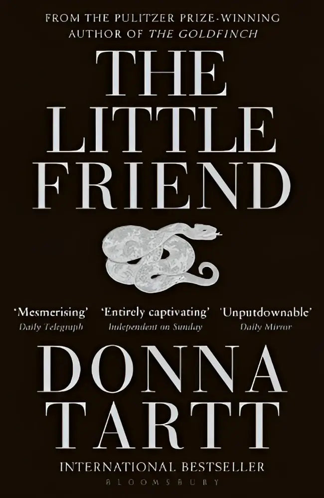 The little friend is a dark brown hardcover book with silver embossed lettering and an ornate silver snake illustration