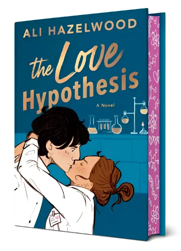 The love hypothesis collector’s edition novel with navy blue cover gold lettering and illustration of two people kissing in lab coats