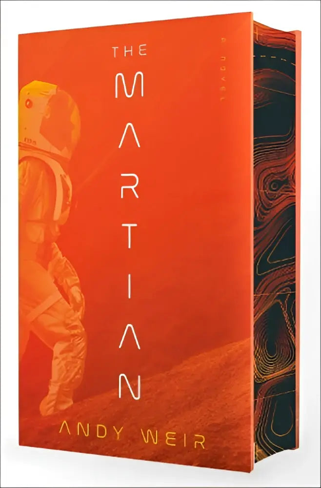The martian deluxe edition hardcover book by andy weir with an orange cover featuring an astronaut silhouette