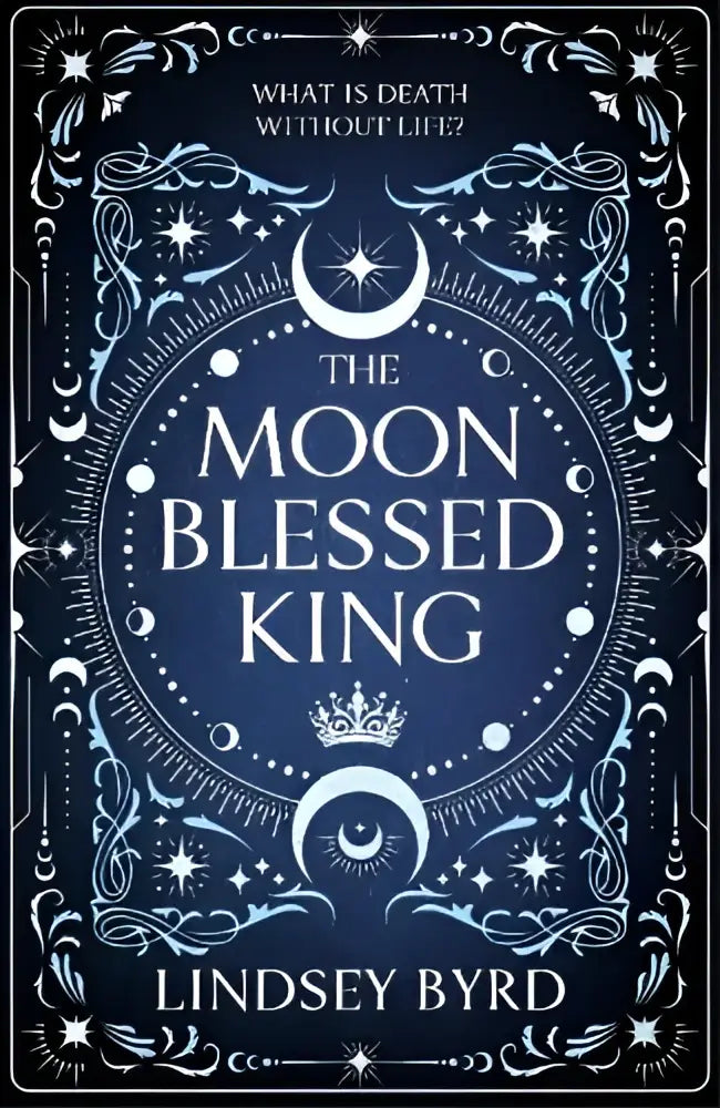 The moon blessed king book features an ornate dark blue cover with intricate silver celestial moon blessed designs