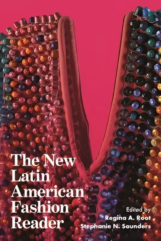 The new latin american fashion reader book cover features a beaded garment in reds and metallics on a pink background