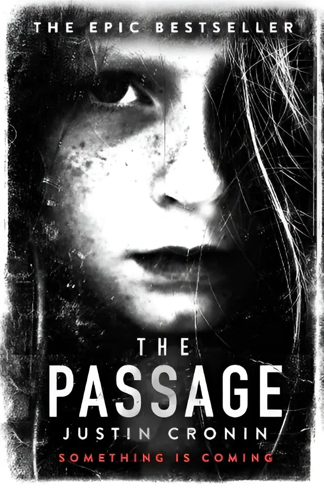 The passage by justin cronin black and white book cover with distressed girl face featuring american fantasy fiction stephen king