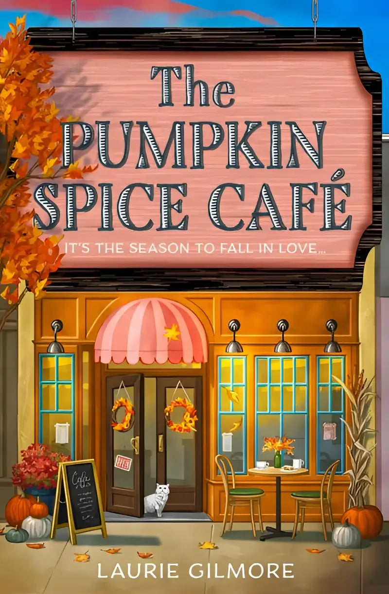 The pumpkin spice café sign features bold black lettering on a warm pink wooden background with white trim in dream harbor